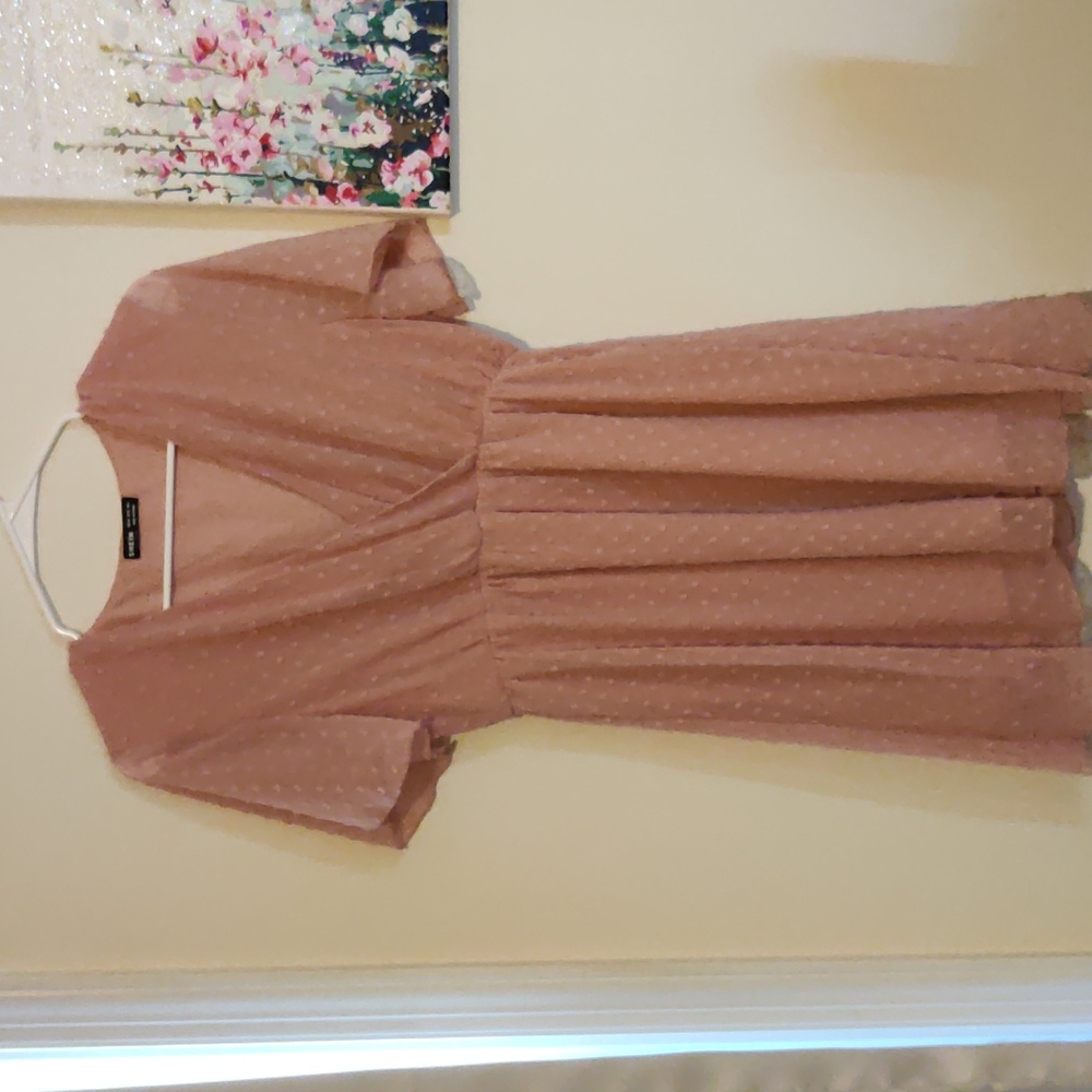 A summer pink polka dot medium size dress